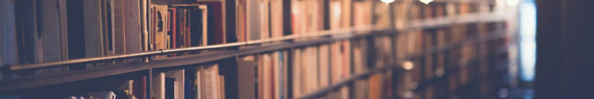 pexels-photo-590493-590493 Rows of bookshelves in a cozy library with warm ambient lighting. Perfect for learning and knowledge themes.